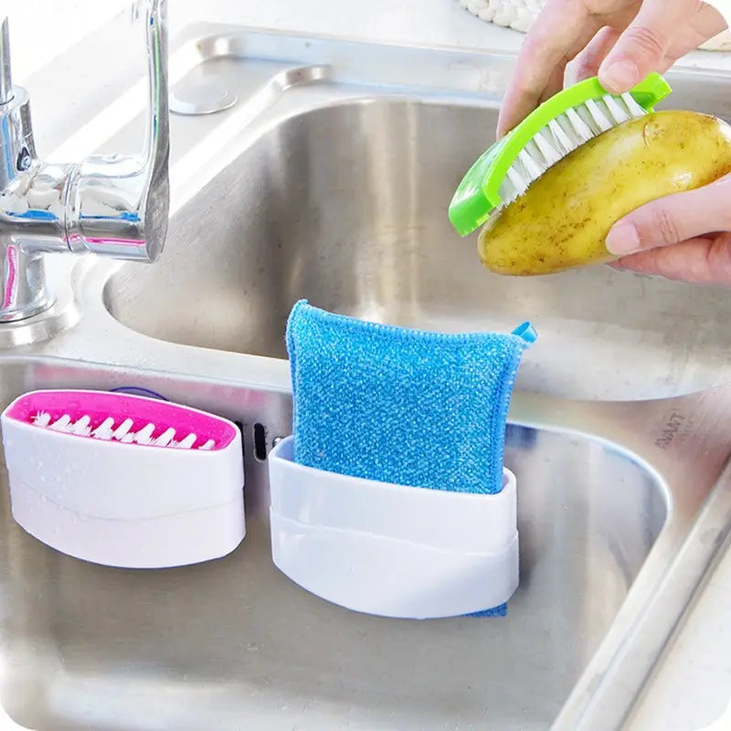 Cutlery brush cleaner cleaning a potato 